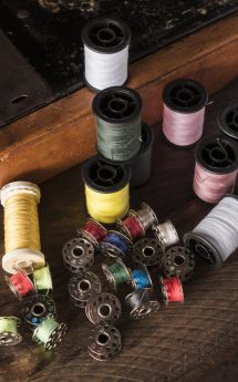 assorted-threads-near-sewing-machine assorted-threads-near-sewing-machine